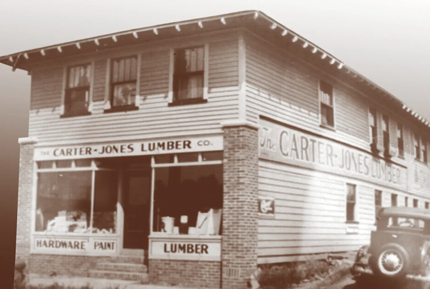 Sepia-toned historic Carter-Jones Lumber Co. store selling hardware, paint and lumber
