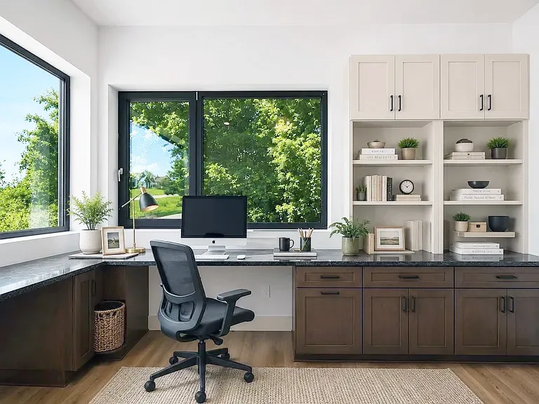 Home office with a wraparound dark desk, wood base cabinets, and white bookshelf uppers