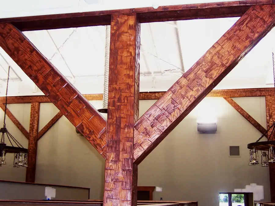Hand-hewn texture timber beams and braces in a large hall