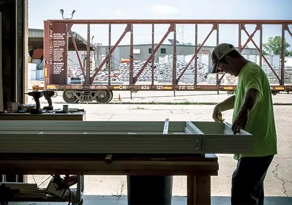 Carter Lumber employee building a truss