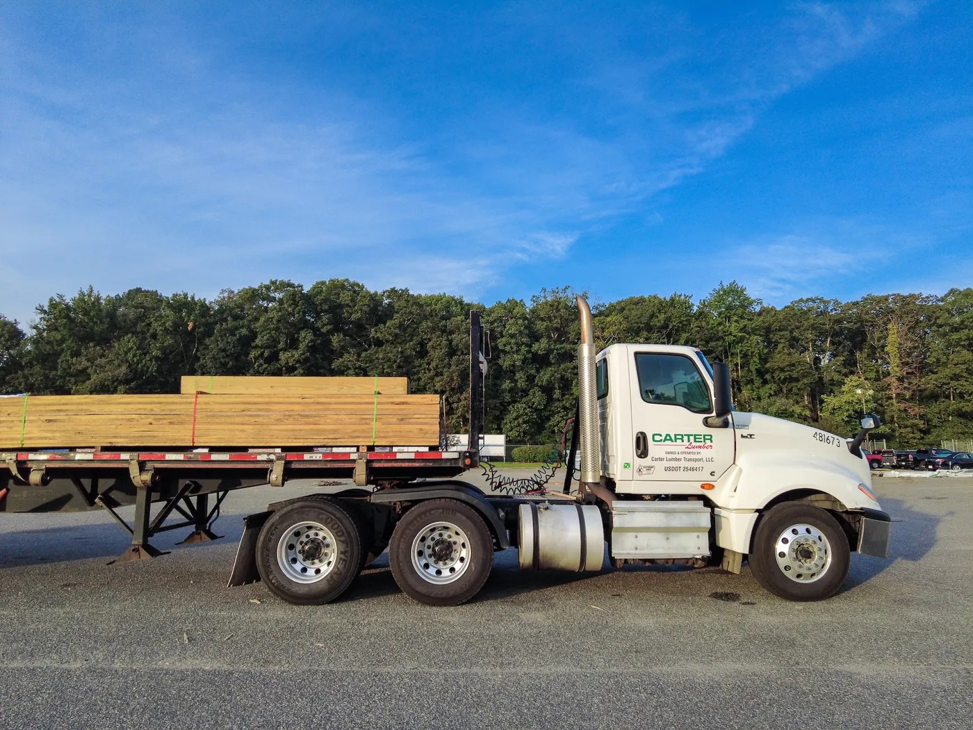 Carter Lumber semi truck hauling a flatbed load of lumber