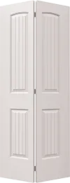 White bifold door with arched V-grooved panels