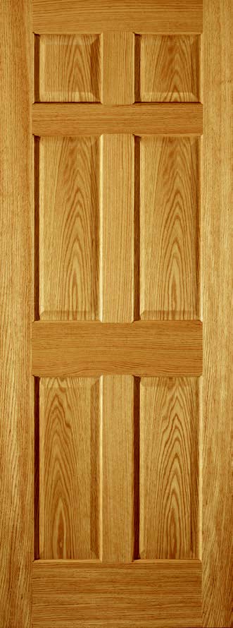 Natural wood six-panel interior door with honey-toned finish